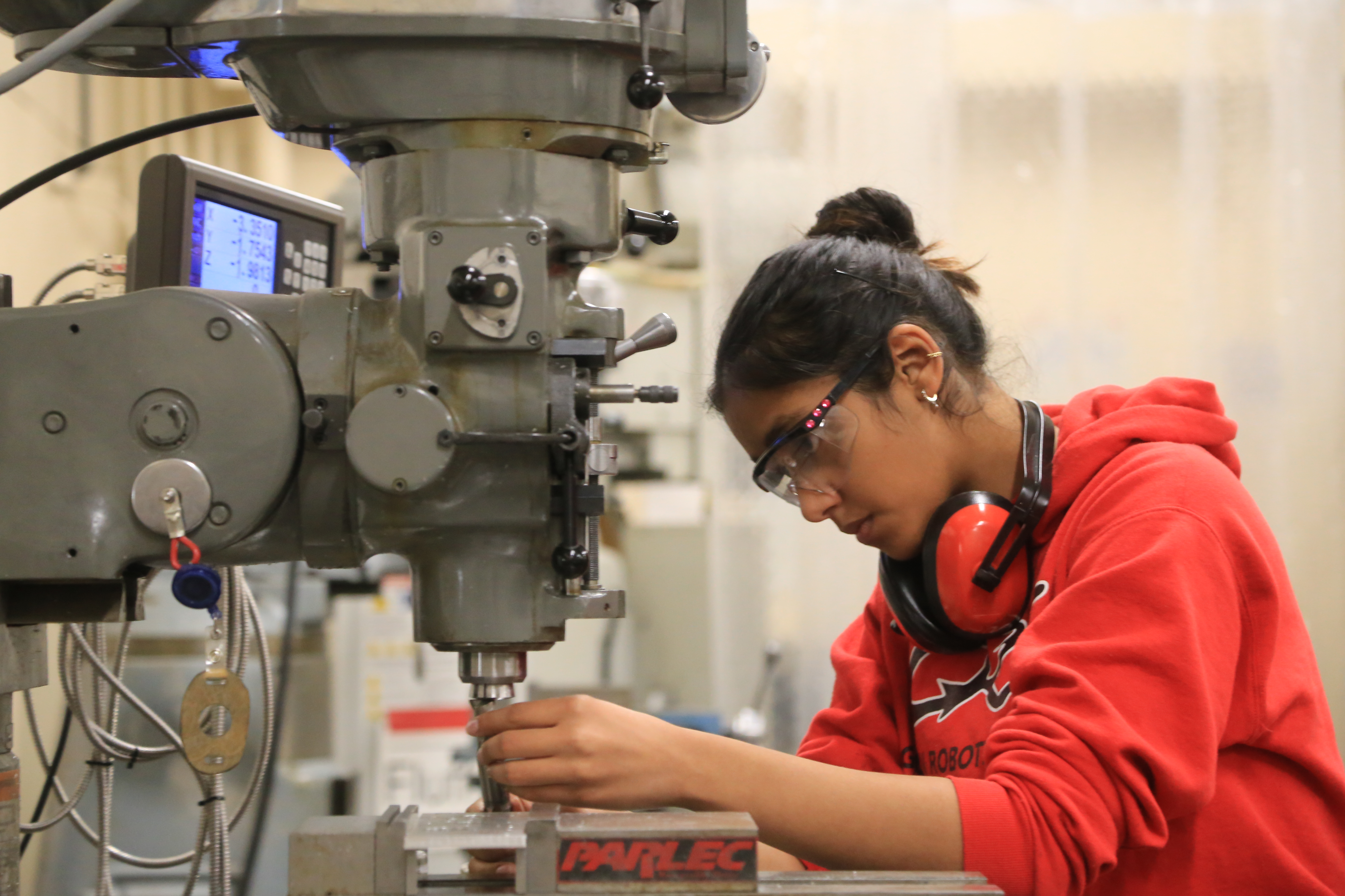 Working on mill in robotics shop